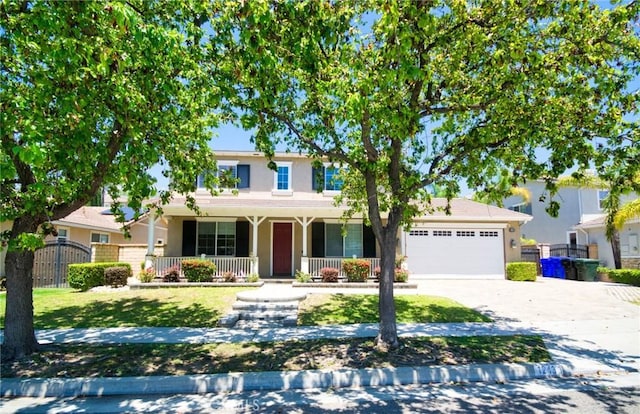 12430 Split Rein Dr, Rancho Cucamonga, CA 91739 - traditional-style house featuring a garage, covered porch, concrete driveway, and stucco siding