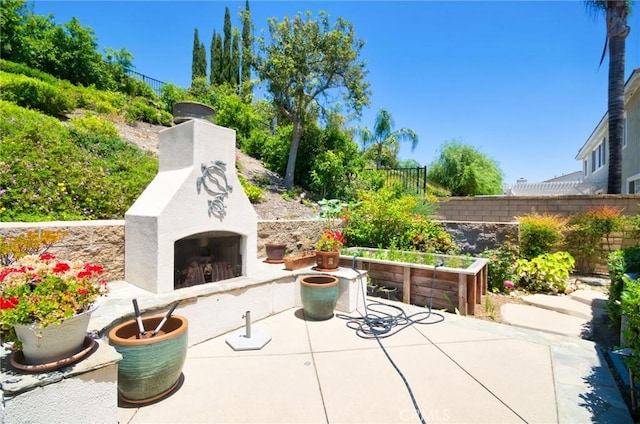 12430 Split Rein Dr, Rancho Cucamonga, CA 91739 - view of patio / terrace featuring exterior fireplace