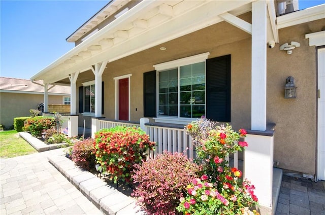 12430 Split Rein Dr, Rancho Cucamonga, CA 91739 - doorway to property featuring covered porch and stucco siding