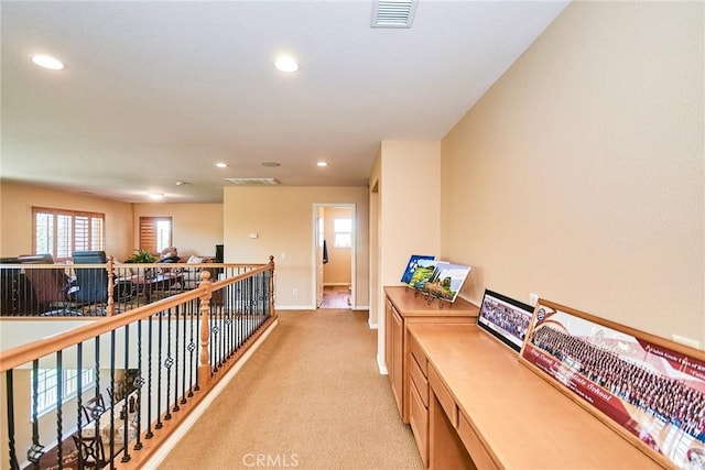 12430 Split Rein Dr, Rancho Cucamonga, CA 91739 - hall featuring light colored carpet, recessed lighting, baseboards, and an upstairs landing