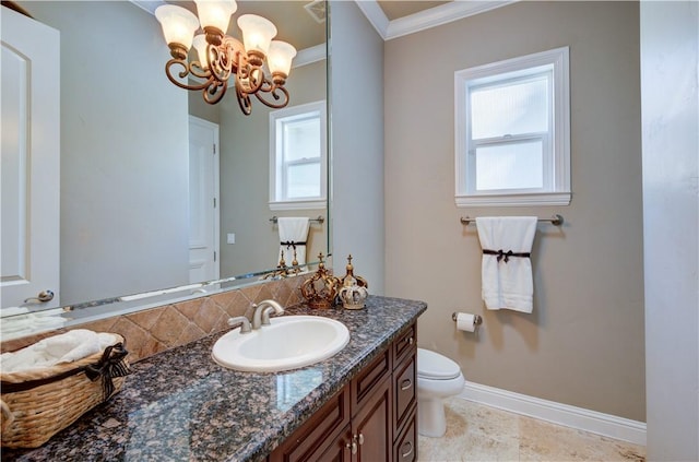 2096 E Olympic Ave, Fresno, CA 93730 - bathroom featuring crown molding, a chandelier, baseboards, plenty of natural light, and toilet