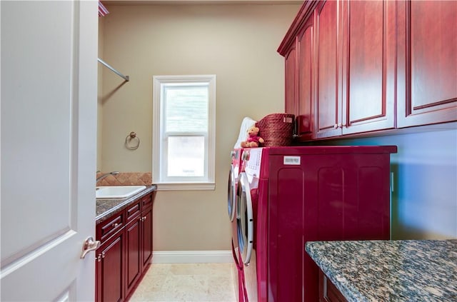 2096 E Olympic Ave, Fresno, CA 93730 - laundry room featuring cabinet space, washer and clothes dryer, and baseboards