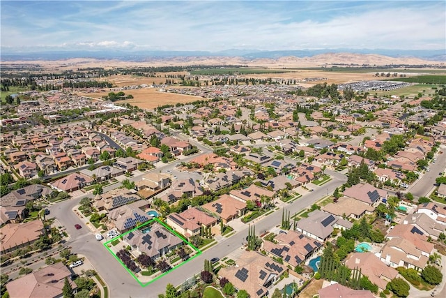 2096 E Olympic Ave, Fresno, CA 93730 - aerial overview of property's location with property boundaries highlighted, nearby suburban area, and mountains