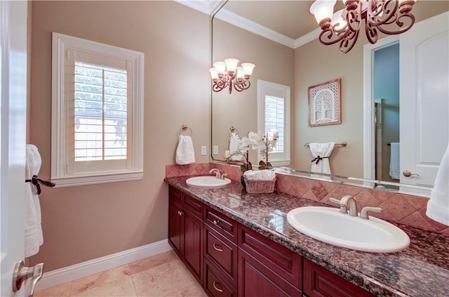 2096 E Olympic Ave, Fresno, CA 93730 - full bathroom featuring a chandelier, crown molding, double vanity, and baseboards