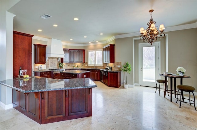 2096 E Olympic Ave, Fresno, CA 93730 - kitchen featuring custom exhaust hood, reddish brown cabinets, a sink, a chandelier, and decorative backsplash