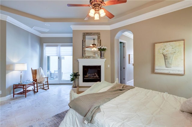 2096 E Olympic Ave, Fresno, CA 93730 - bedroom with arched walkways, baseboards, crown molding, and a glass covered fireplace