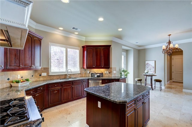 2096 E Olympic Ave, Fresno, CA 93730 - kitchen featuring a sink, dark stone counters, tasteful backsplash, a chandelier, and a kitchen island