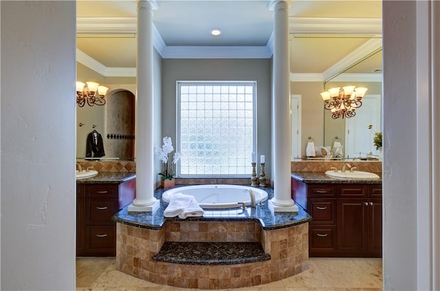 2096 E Olympic Ave, Fresno, CA 93730 - full bath with two vanities, a chandelier, crown molding, a garden tub, and decorative columns