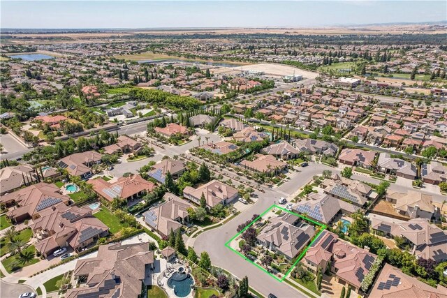 2096 E Olympic Ave, Fresno, CA 93730 - aerial overview of property's location featuring nearby suburban area, a nearby body of water, and property boundaries highlighted