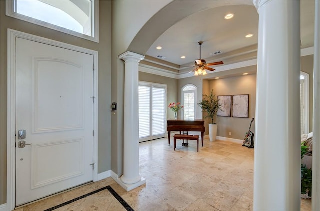 2096 E Olympic Ave, Fresno, CA 93730 - entrance foyer featuring ornate columns, baseboards, arched walkways, ceiling fan, and a raised ceiling