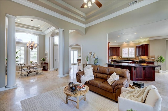 2096 E Olympic Ave, Fresno, CA 93730 - living area featuring healthy amount of natural light, arched walkways, decorative columns, crown molding, and recessed lighting