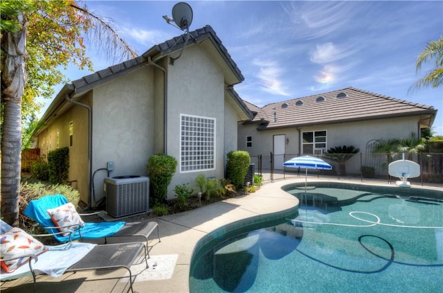 2096 E Olympic Ave, Fresno, CA 93730 - view of pool featuring central AC unit and a patio