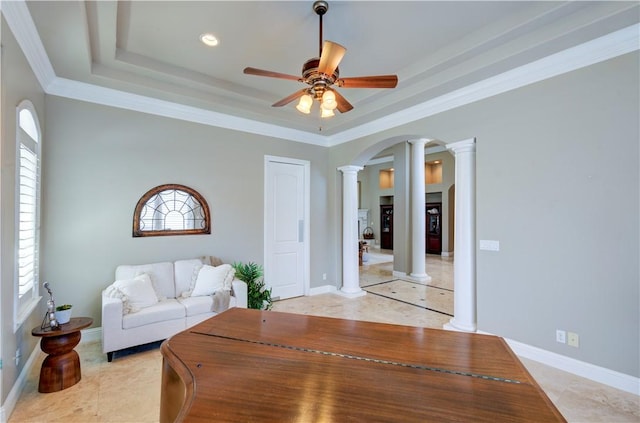 2096 E Olympic Ave, Fresno, CA 93730 - living area featuring decorative columns, ceiling fan, a raised ceiling, arched walkways, and crown molding