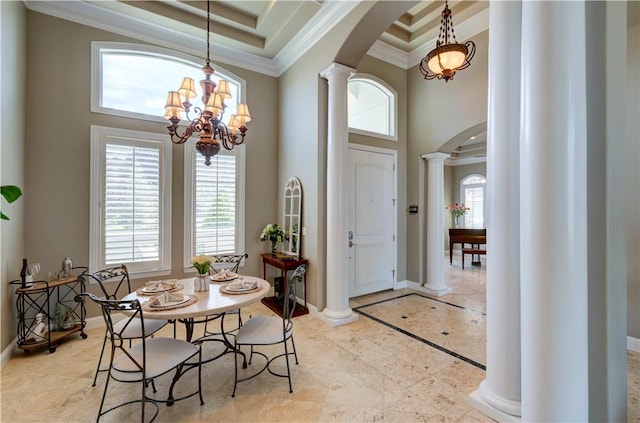 2096 E Olympic Ave, Fresno, CA 93730 - dining space featuring arched walkways, a high ceiling, decorative columns, ornamental molding, and baseboards