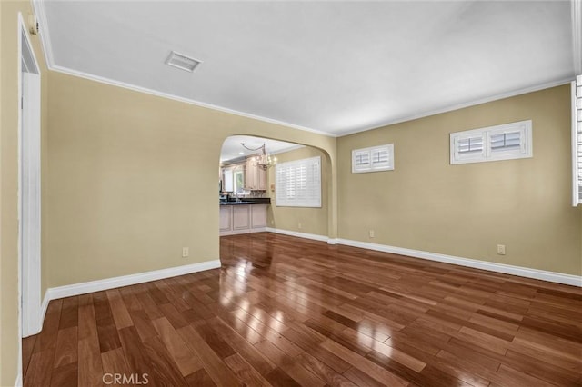 3163 La Clede Ave, Los Angeles, CA 90039 - unfurnished room featuring arched walkways, a chandelier, hardwood / wood-style flooring, ornamental molding, and baseboards