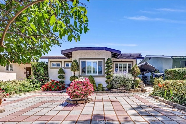 3163 La Clede Ave, Los Angeles, CA 90039 - view of front of home with stucco siding and a patio area
