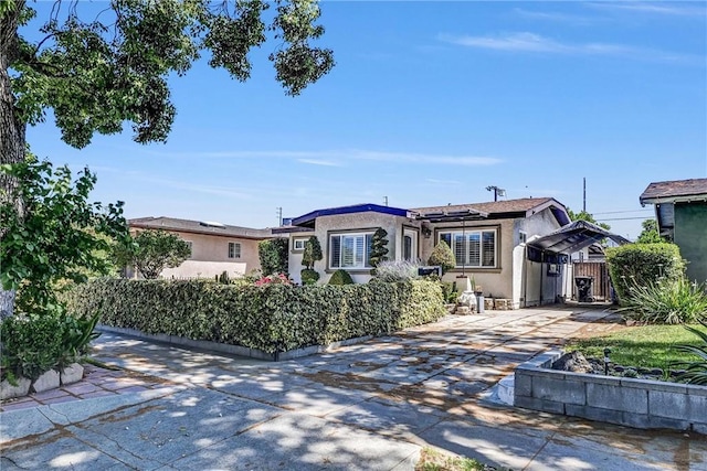3163 La Clede Ave, Los Angeles, CA 90039 - view of front of property featuring concrete driveway, solar panels, and stucco siding