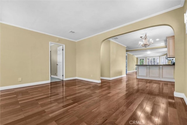 3163 La Clede Ave, Los Angeles, CA 90039 - unfurnished room featuring arched walkways, a chandelier, wood finished floors, baseboards, and crown molding