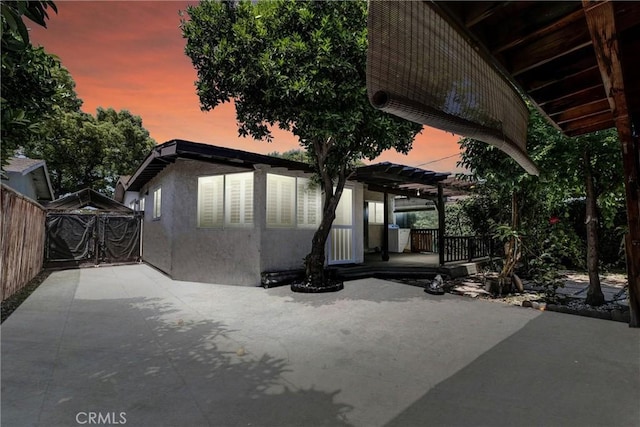 3163 La Clede Ave, Los Angeles, CA 90039 - back of property at dusk with a patio area, a pergola, and stucco siding