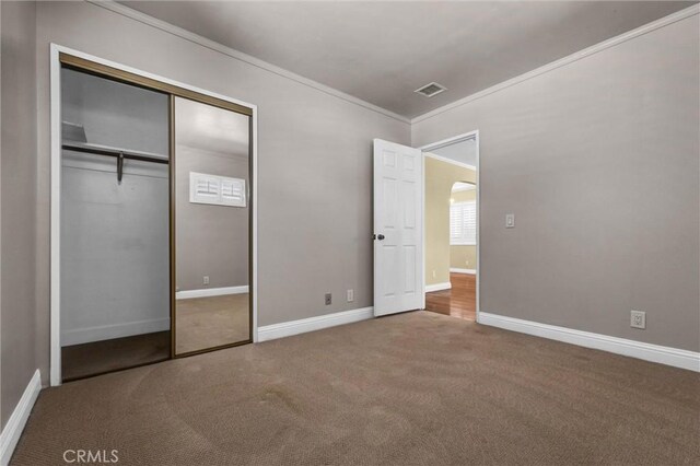 3163 La Clede Ave, Los Angeles, CA 90039 - unfurnished bedroom featuring ornamental molding, carpet floors, arched walkways, baseboards, and a closet