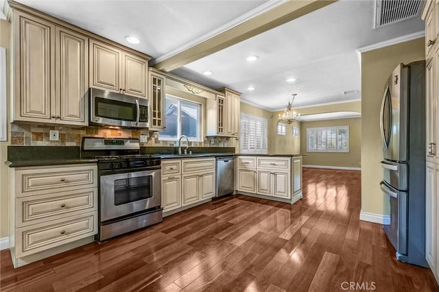 3163 La Clede Ave, Los Angeles, CA 90039 - kitchen featuring stainless steel appliances, cream cabinetry, ornamental molding, a peninsula, and baseboards