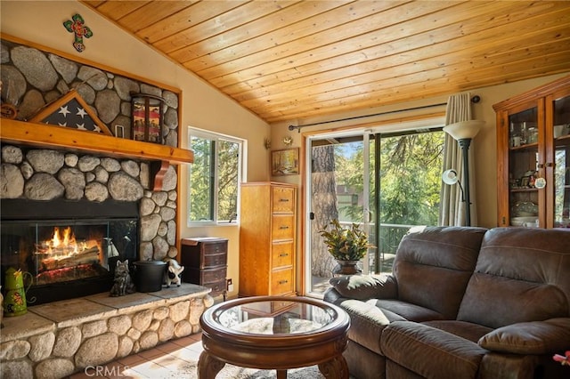 22864 Alder Ln, Crestline, CA 92325 - living area featuring wood ceiling, a stone fireplace, and vaulted ceiling