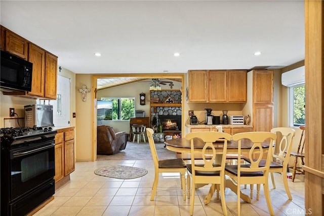 22864 Alder Ln, Crestline, CA 92325 - dining area featuring an AC wall unit, a fireplace, plenty of natural light, recessed lighting, and light tile patterned floors