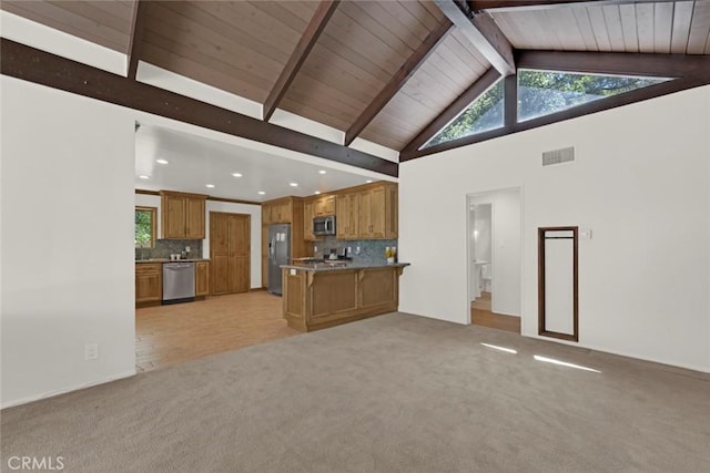 8402 Mcgroarty St, Sunland, CA 91040 - kitchen featuring stainless steel appliances, open floor plan, brown cabinetry, light colored carpet, and wood ceiling with exposed beams