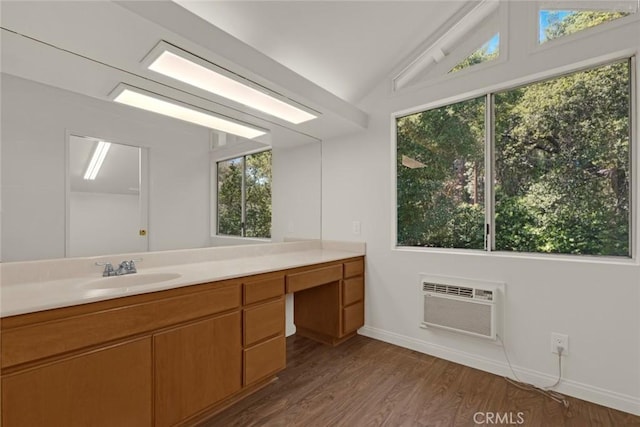 8402 Mcgroarty St, Sunland, CA 91040 - bathroom with a wall mounted air conditioner, vaulted ceiling, vanity, baseboards, and wood finished floors