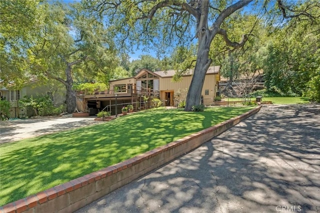 8402 Mcgroarty St, Sunland, CA 91040 - rear view of house with a lawn and a deck