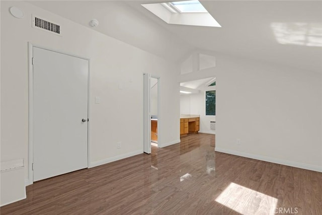 8402 Mcgroarty St, Sunland, CA 91040 - spare room featuring a skylight, wood finished floors, lofted ceiling, and baseboards