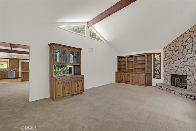 8402 Mcgroarty St, Sunland, CA 91040 - unfurnished living room featuring light carpet, beam ceiling, a stone fireplace, and high vaulted ceiling