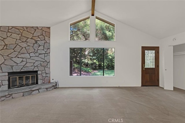8402 Mcgroarty St, Sunland, CA 91040 - unfurnished living room with carpet flooring, a fireplace, plenty of natural light, beamed ceiling, and high vaulted ceiling