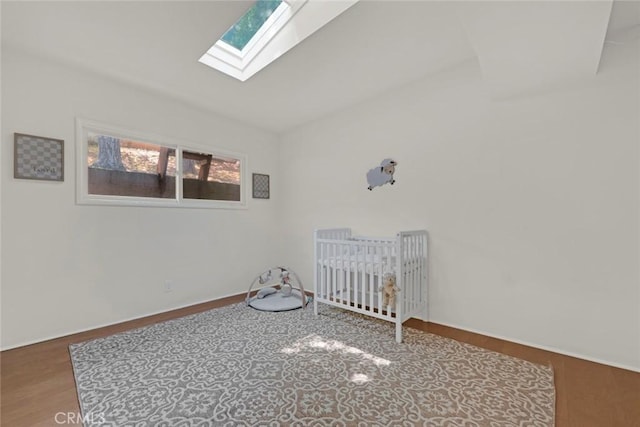 8402 Mcgroarty St, Sunland, CA 91040 - unfurnished room featuring a skylight, vaulted ceiling, and wood finished floors