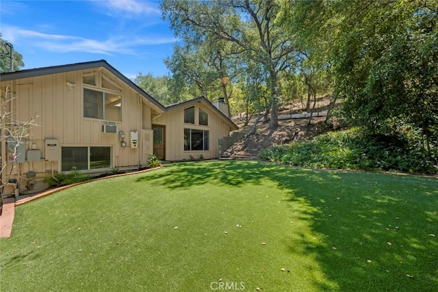 8402 Mcgroarty St, Sunland, CA 91040 - rear view of house with a yard, a chimney, and board and batten siding