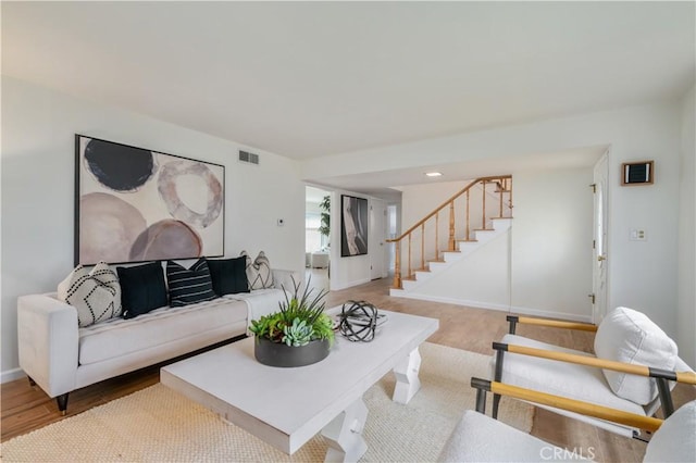 20619 Entradero Ave, Torrance, CA 90503 - living room with stairs, light wood-style floors, and baseboards