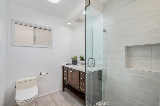 20619 Entradero Ave, Torrance, CA 90503 - full bathroom with a shower stall, wood finished floors, baseboards, toilet, and vanity