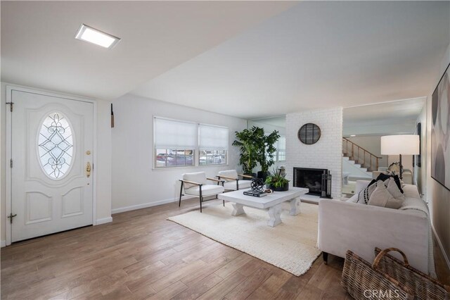 20619 Entradero Ave, Torrance, CA 90503 - living room featuring plenty of natural light, wood finished floors, baseboards, and a fireplace