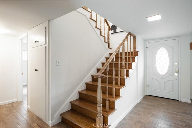 20619 Entradero Ave, Torrance, CA 90503 - foyer entrance featuring stairs, light wood finished floors, and baseboards