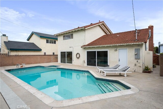 20619 Entradero Ave, Torrance, CA 90503 - view of swimming pool featuring a patio, a fenced backyard, and a pool with connected hot tub