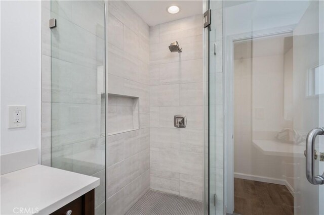 20619 Entradero Ave, Torrance, CA 90503 - bathroom with a shower stall, vanity, wood finished floors, baseboards, and recessed lighting