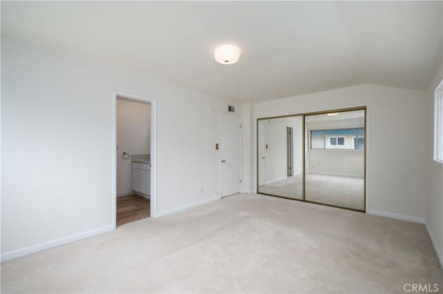 20619 Entradero Ave, Torrance, CA 90503 - unfurnished bedroom featuring carpet floors, a closet, baseboards, and vaulted ceiling