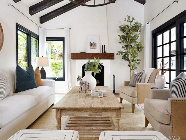 28021 Camino Santo Domingo, San Juan Capistrano, CA 92675 - living room featuring beam ceiling, baseboards, and high vaulted ceiling