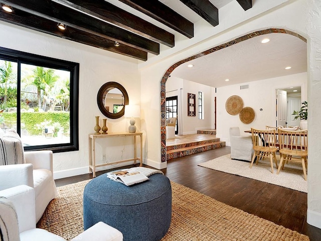 28021 Camino Santo Domingo, San Juan Capistrano, CA 92675 - living room featuring arched walkways, wood finished floors, beam ceiling, baseboards, and recessed lighting