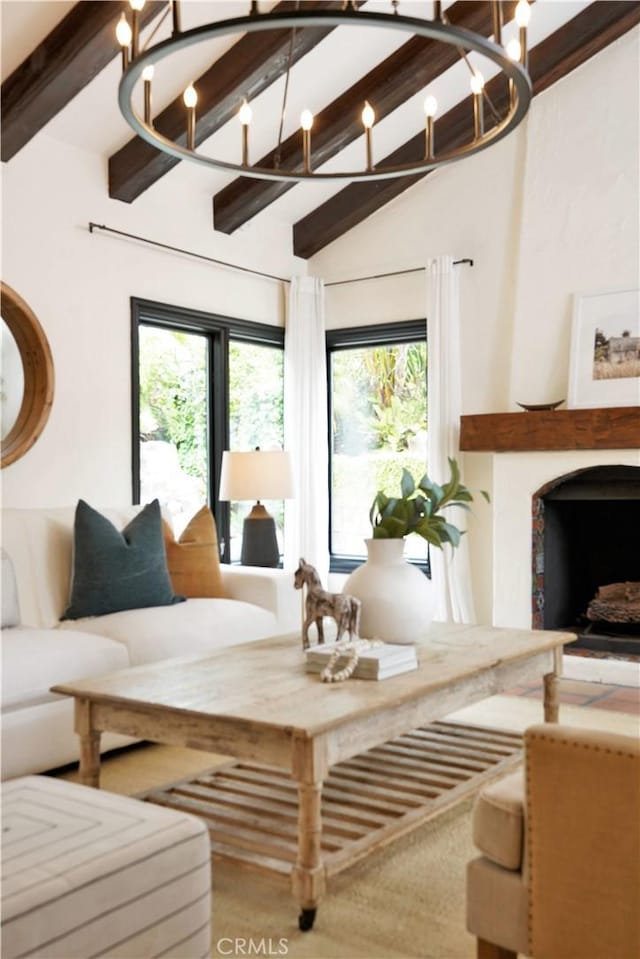 28021 Camino Santo Domingo, San Juan Capistrano, CA 92675 - living room with healthy amount of natural light, a fireplace, and a chandelier