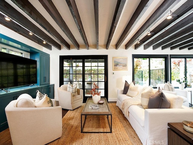 28021 Camino Santo Domingo, San Juan Capistrano, CA 92675 - living room featuring beam ceiling, wood finished floors, plenty of natural light, and baseboards