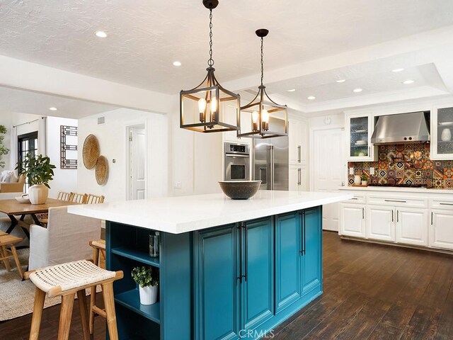 28021 Camino Santo Domingo, San Juan Capistrano, CA 92675 - kitchen featuring ventilation hood, appliances with stainless steel finishes, white cabinetry, open shelves, and backsplash