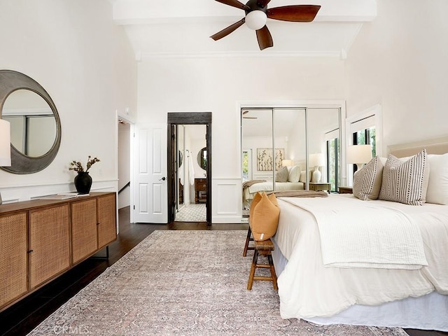 28021 Camino Santo Domingo, San Juan Capistrano, CA 92675 - bedroom with wood finished floors, a towering ceiling, ornamental molding, ceiling fan, and multiple closets
