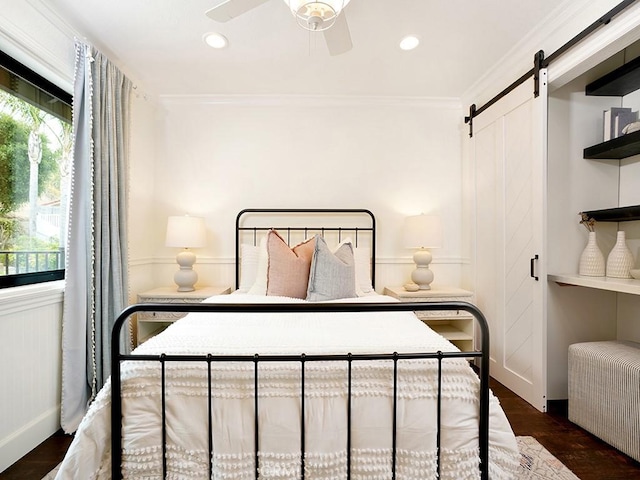28021 Camino Santo Domingo, San Juan Capistrano, CA 92675 - bedroom featuring a barn door, dark wood-style floors, recessed lighting, crown molding, and ceiling fan
