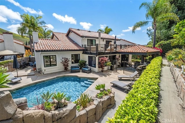 28021 Camino Santo Domingo, San Juan Capistrano, CA 92675 - rear view of house with a gazebo, a tiled roof, a balcony, a chimney, and a patio